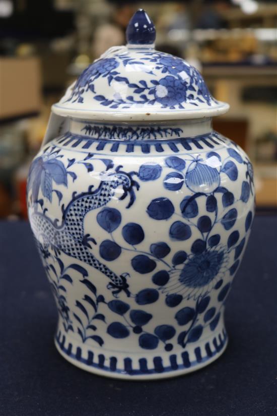 A 19th century Chinese blue and white vase and cover, decorated with dragons height 20cm